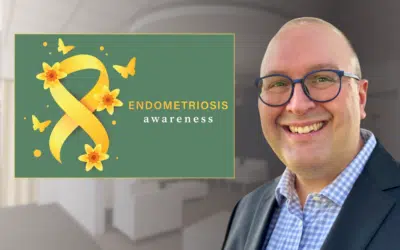Dr. Spencer Ferrell with a Endometriosis awareness poster.