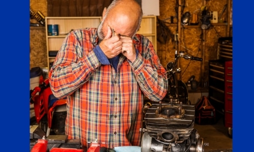 Man with an eye injury in his workshop.