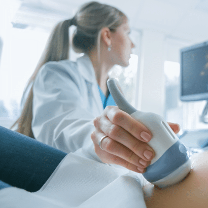 Ultrasound technician performing a fetal anatomy ultrasound.