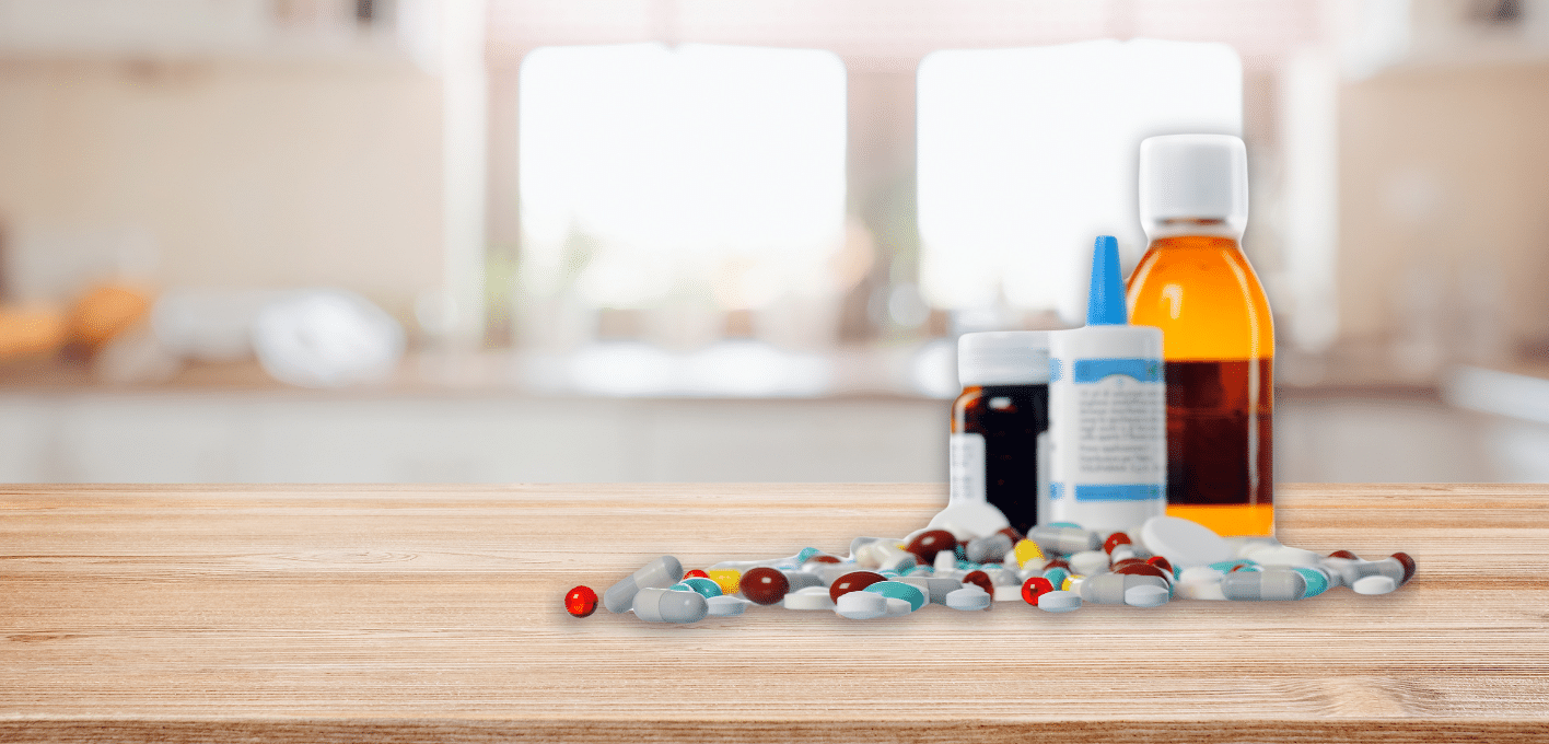 Unused pills and medications on a countertop.