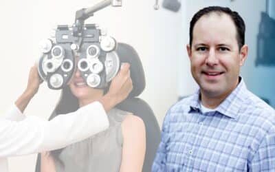Dr. Thomas Bryan in with a patient having an eye exam.