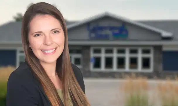 Image of Dr. Hannah Schull in front of Lakeview Clinic in Watertown, MN.